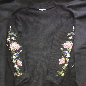 black sweater with choker cutout and embroidery